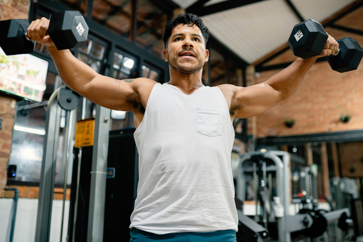 A man at a gym lifting weights after hormone therapy in Sequim.